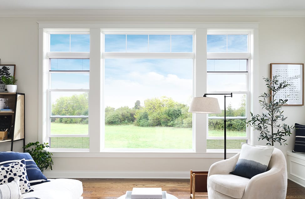 a fixed window flanked by two double-hung windows with the hidden screen feature