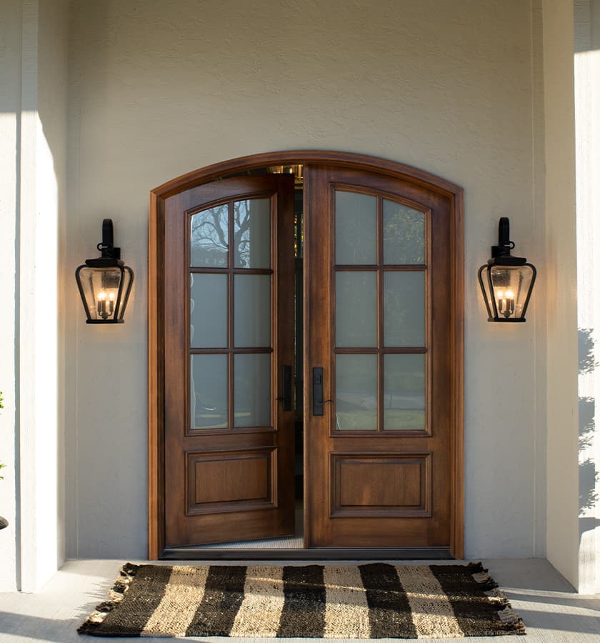 exterior view of a two-panel continuous springline entry door