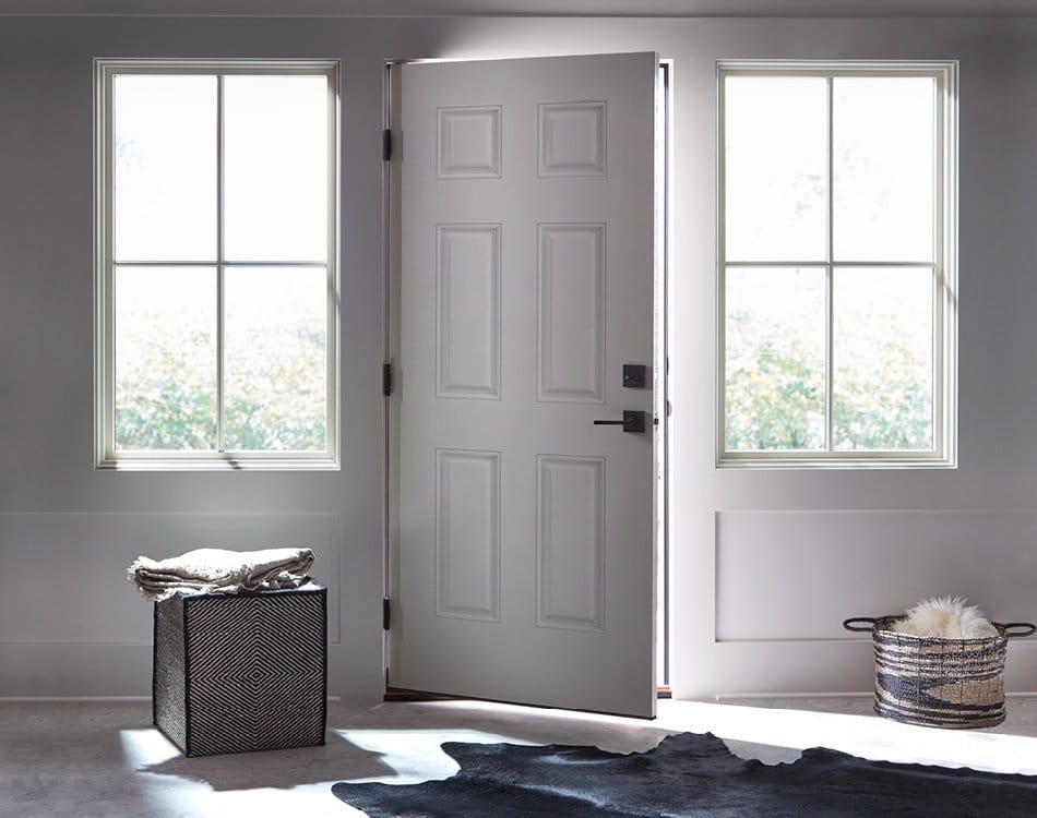 White Front Door & Windows Make For A Beautiful Entryway Contemporary white door open a crack with two white windows on either side