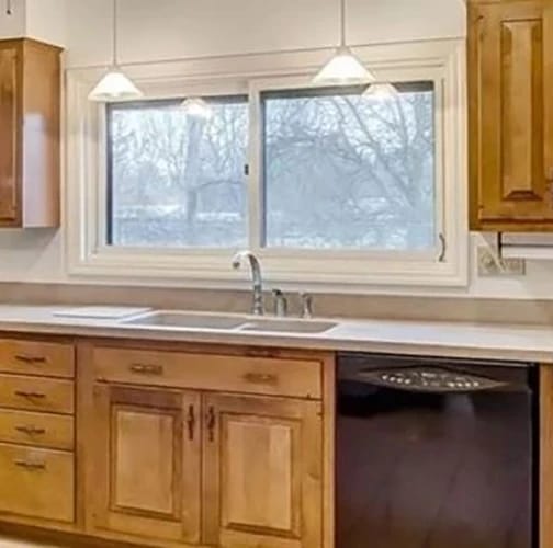 Before image of Yellow Springs kitchen with white vinyl sliding window.