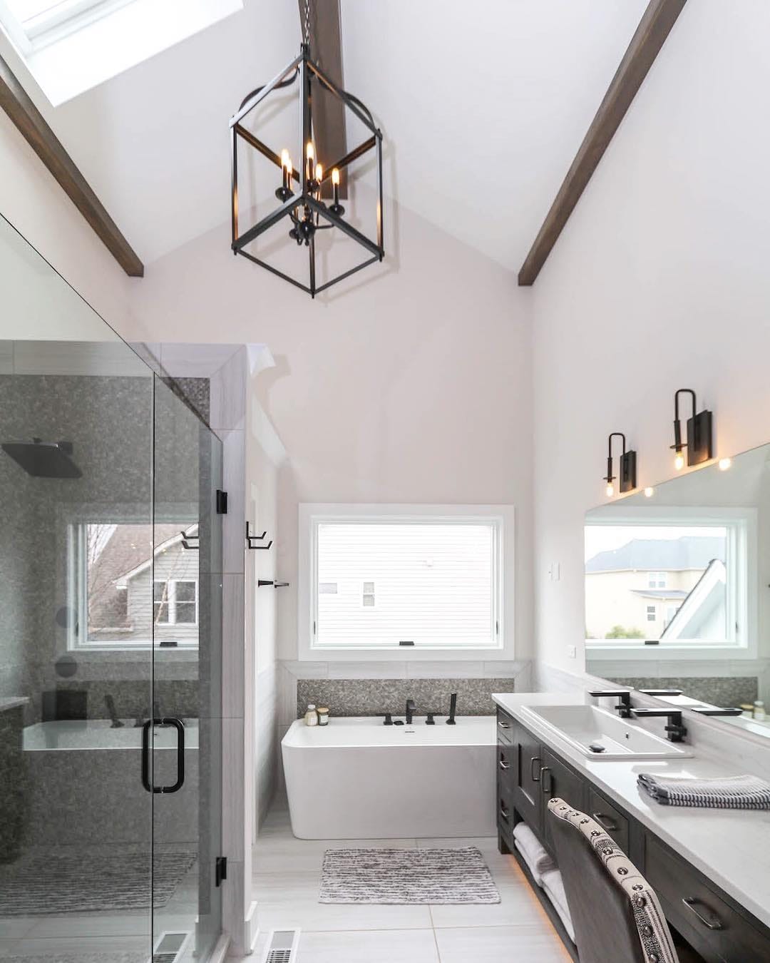 Awning Window Ventilates Contemporary Bathroom modern bathroom with glass shower and awning window over freestanding tub