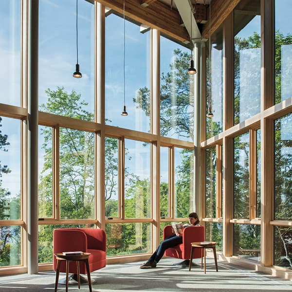 public library with custom window combinations surrounding a reader