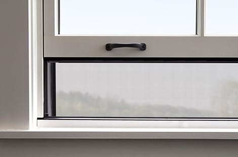 rolscreen integrated screen on a double-hung window