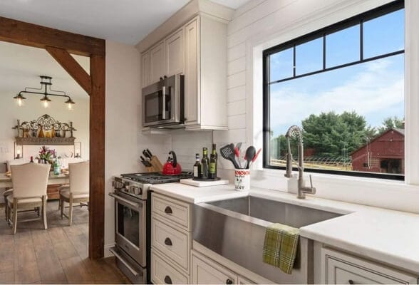 Black Picture Window For Farmhouse Style Kitchen Farmhouse style kitchen with black picture window over the sink