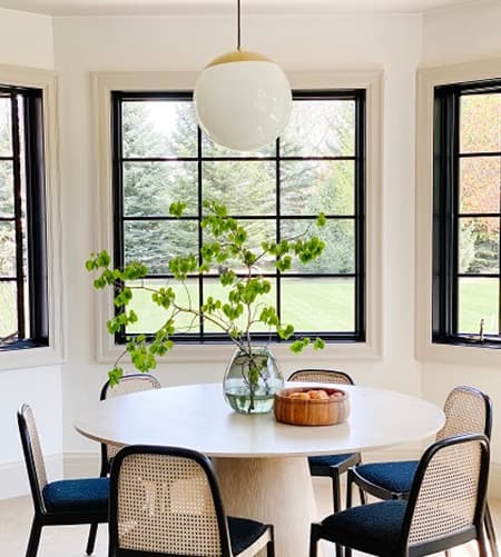 Breakfast nook with black frame windows
