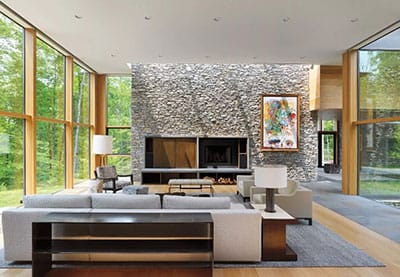 living room with wood-clad windows from floor to ceiling on both the left and right sides