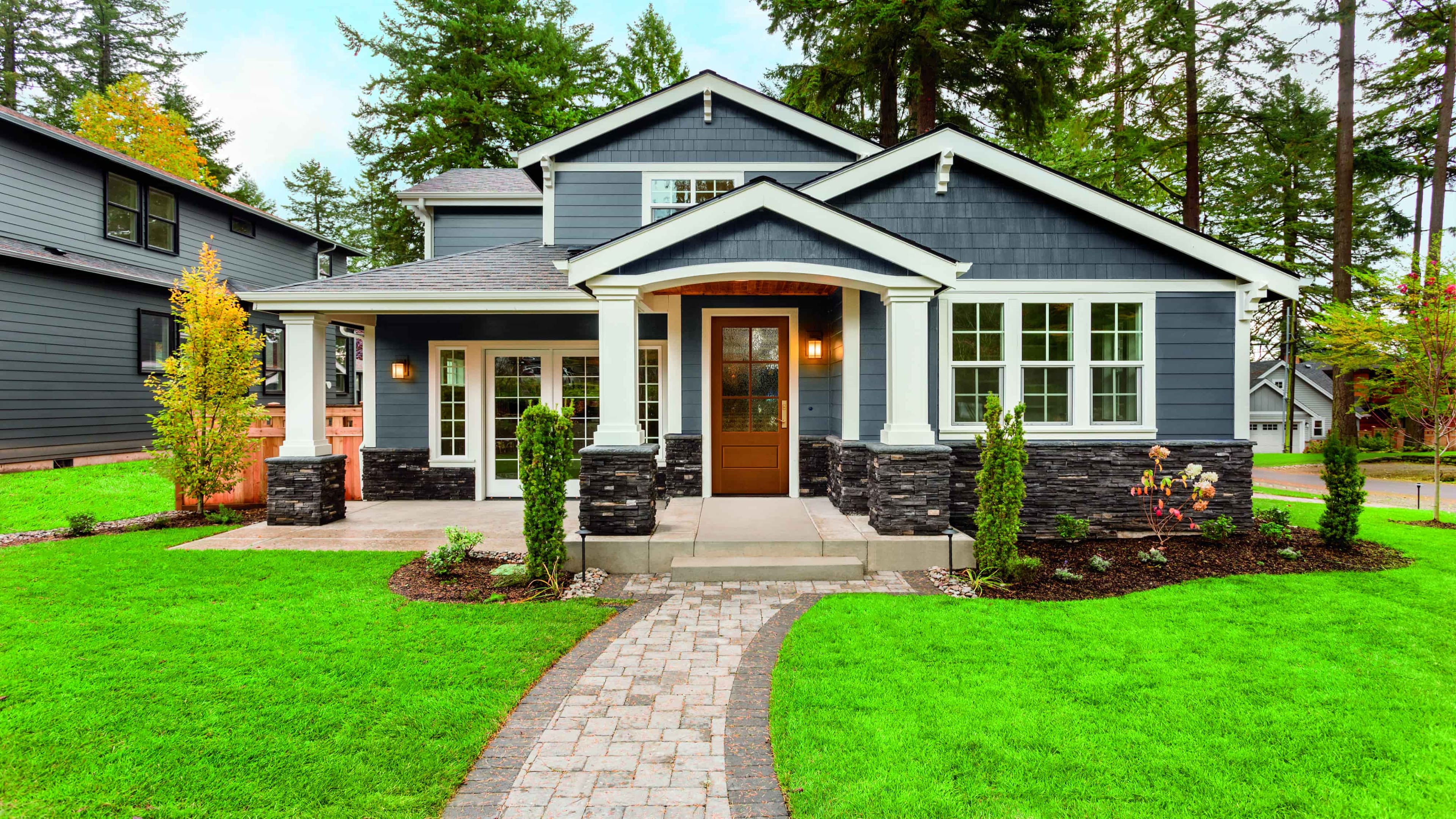 Farmhouse Front Door Offers Natural Light With Obscure Glass Home with farmhouse front door, blue siding, and white trim