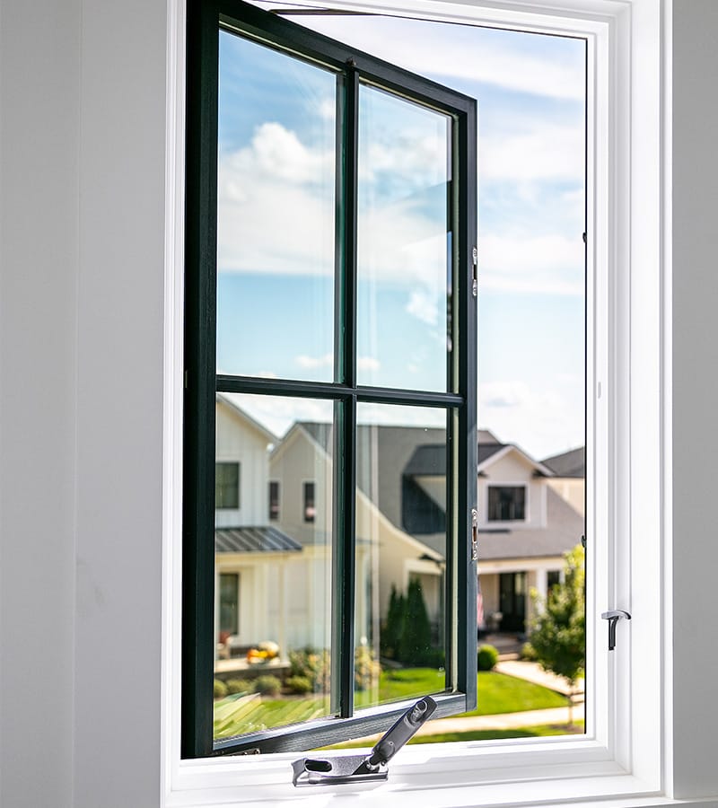 a single large black casement window with a chrome crank