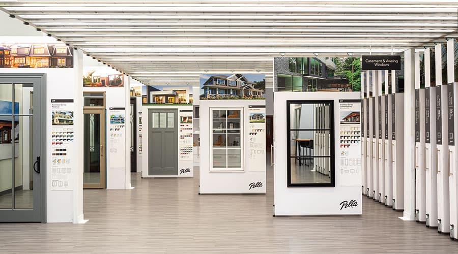 Several window and door samples on a Pella floor display