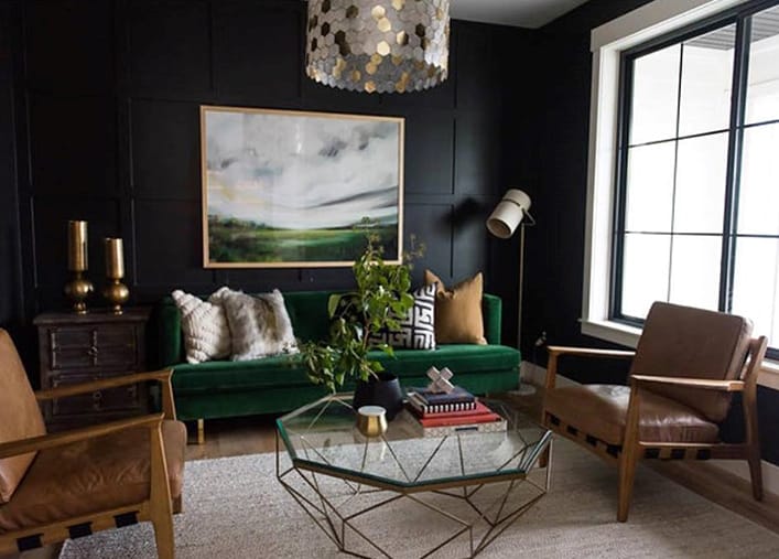 Black Windows Make Bold Statement In Contemporary Design large black windows light living room with black walls, green couch, and brown leather chairs