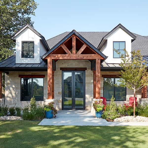 a natural wood contemporary home with gabled dormers