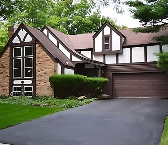 Before - Tudor Style Home With Old Brown Windows two story brown and white tudor style home with brown windows