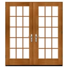 Traditional Double wooden French doors with rectangular grid glass panes, natural oak finish and brushed chrome handles