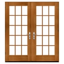 Traditional Double wooden French doors with rectangular grid glass panes, natural oak finish and brushed chrome handles