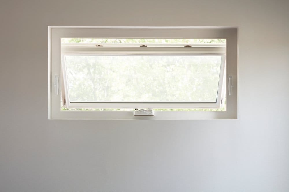 Pella® 250 Series Awning Window Offers Energy Efficiency Vinyl awning window slightly open for ventilation