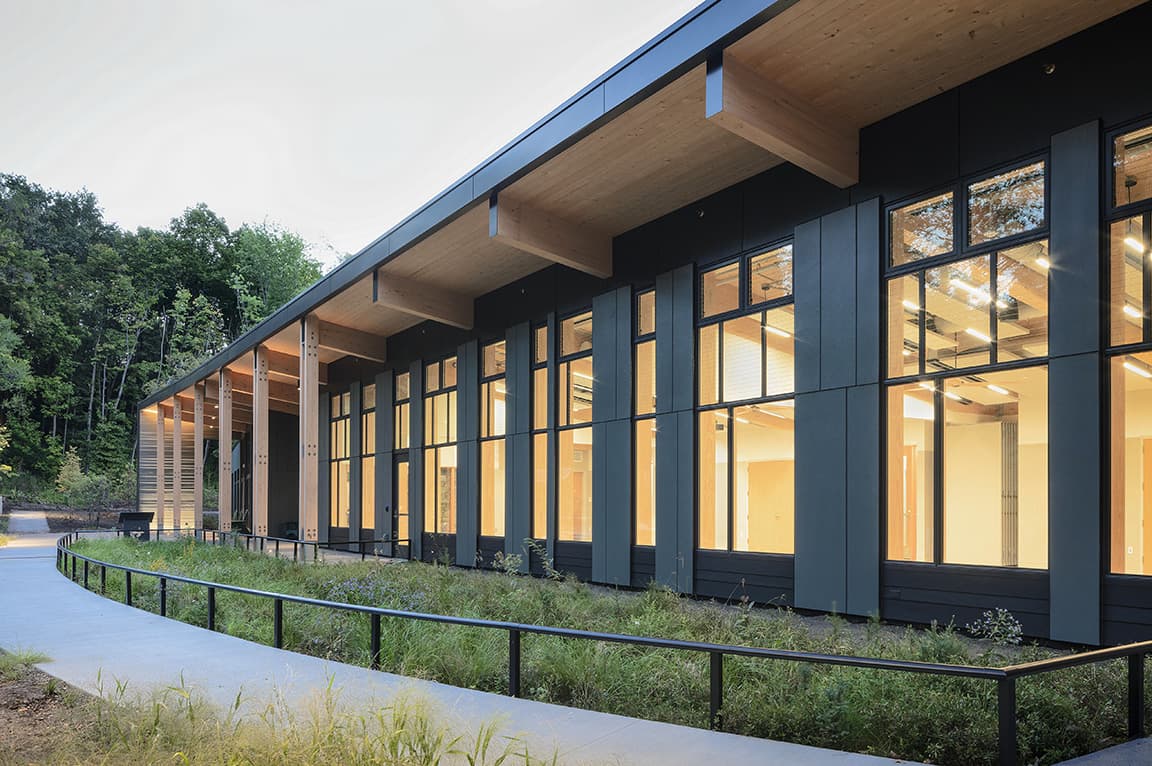 Exterior of St. Louis Park nature center showcasing newly installed black Pella windows.